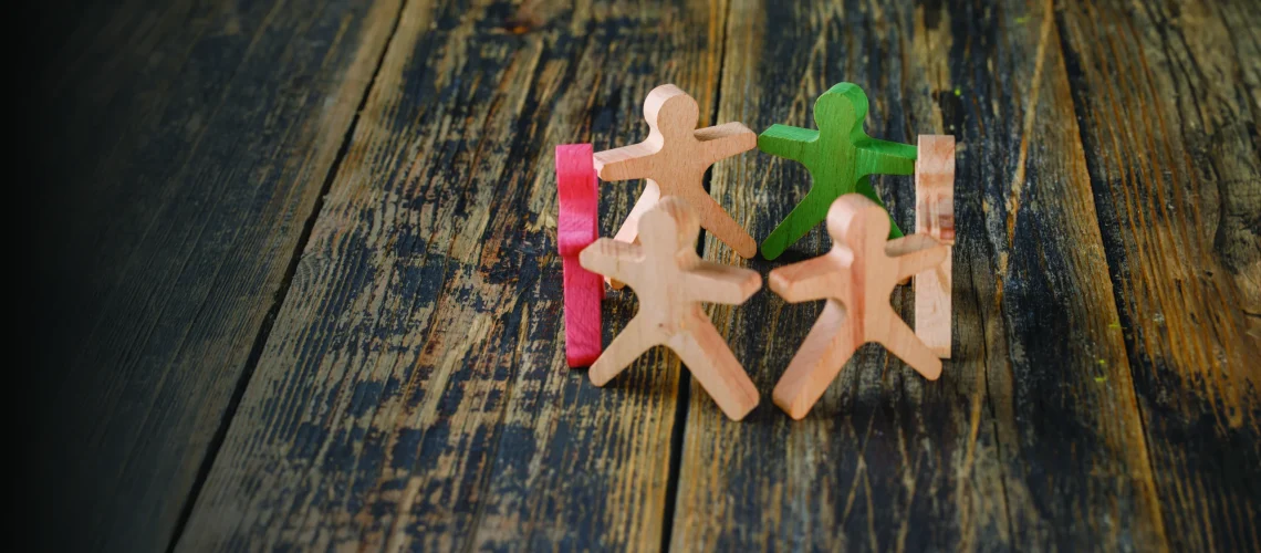 3 business-success-teamwork-concept-with-wooden-figures-people-wooden-table-top-view