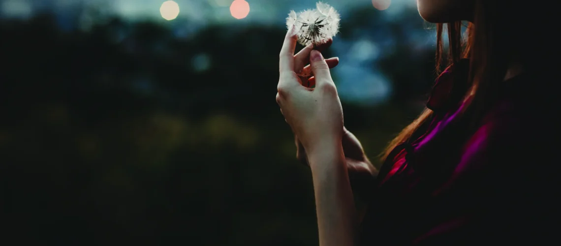 female-portrait-nature-pretty-woman-plays-with-dandelion-stand